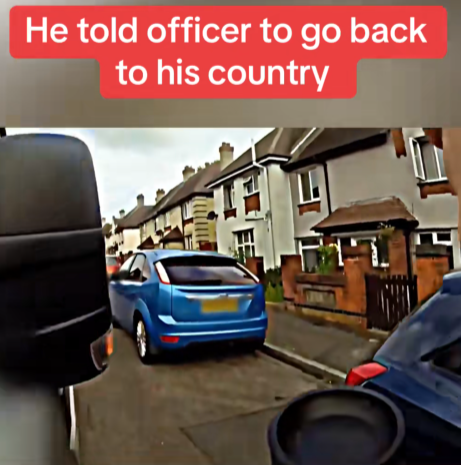 “Driver’s Outburst Caught on Camera: The Shocking Moment He Told an Officer to ‘Go Back to His Country’”